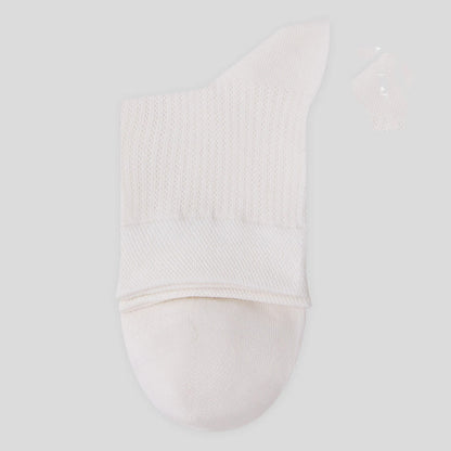 Chaussettes mi-mollet en maille de coton de couleur unie (7 paires)