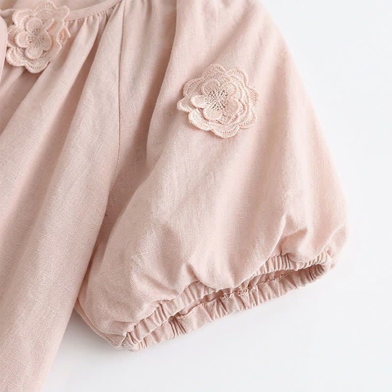 Blouse à manches bouffantes et application florale, noué sur le devant, avec nœud sur le devant. - image 5