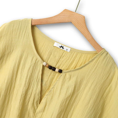 Ensemble deux pièces jaune ample composé d'un haut ample et d'une jupe fleurie assortie - image 2